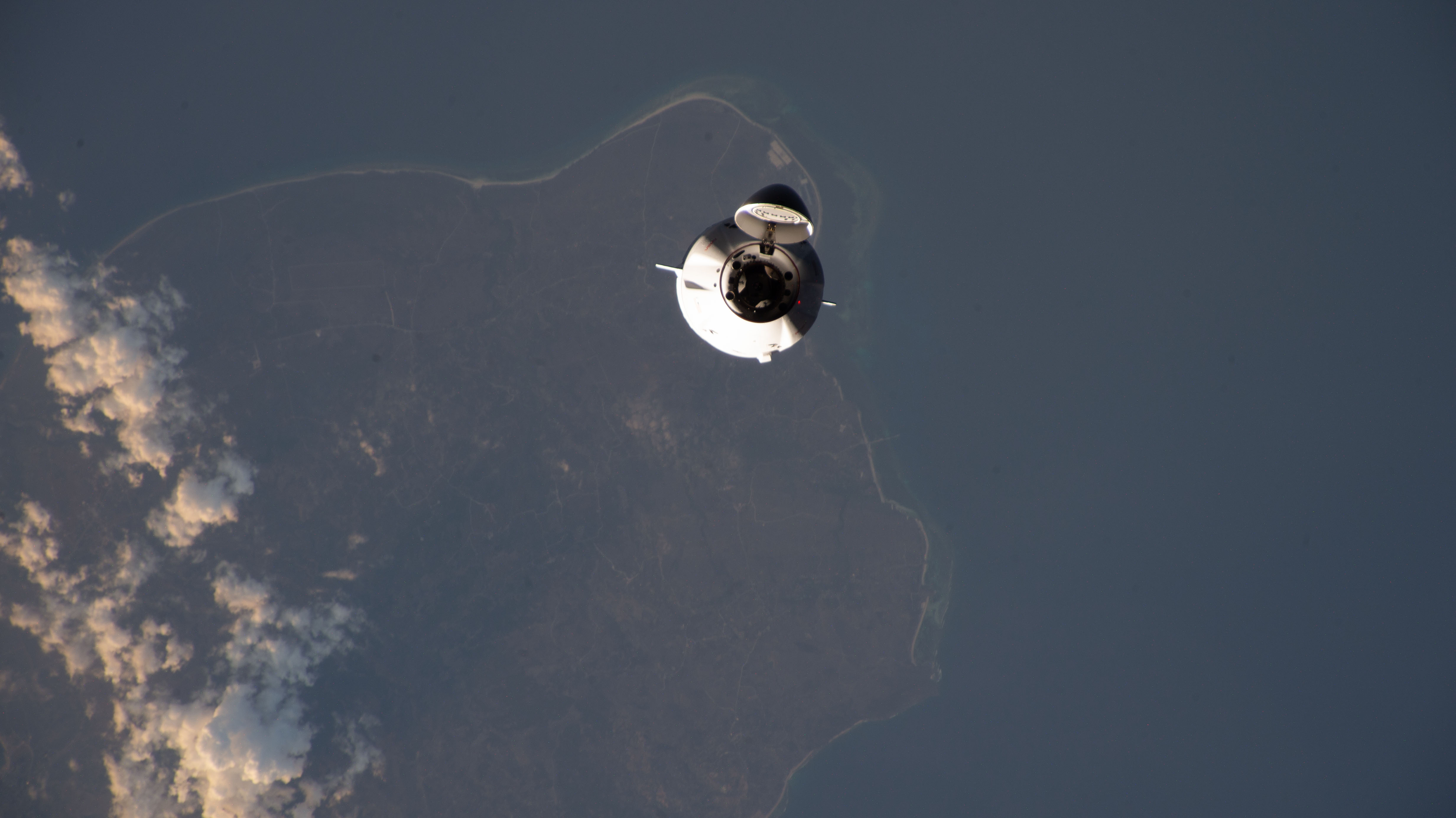 The SpaceX Dragon cargo spacecraft, on the company's 29th commercial resupply mission for NASA, approaches the International Space Station while orbiting 261 miles above the Lesser Sunda Islands.