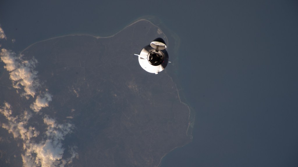The SpaceX Dragon cargo spacecraft, on the company's 29th commercial resupply mission for NASA, approaches the International Space Station while orbiting 261 miles above the Lesser Sunda Islands.