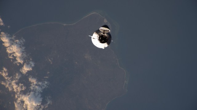 The SpaceX Dragon cargo spacecraft, on the company's 29th commercial resupply mission for NASA, approaches the International Space Station while orbiting 261 miles above the Lesser Sunda Islands.
