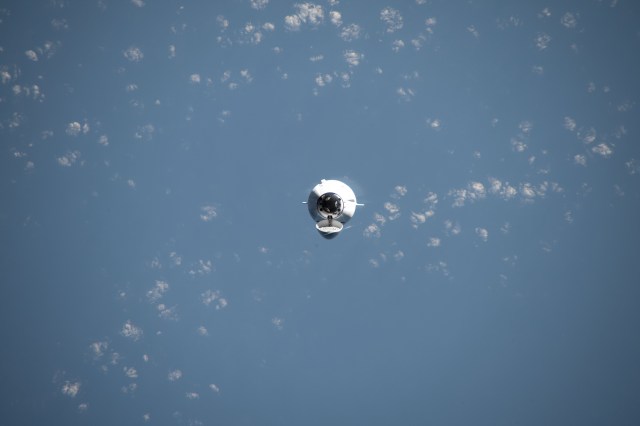 The SpaceX Dragon cargo spacecraft, on the company's 29th commercial resupply mission for NASA, approaches the International Space Station while orbiting 261 miles above the Indian Ocean in between Australia and Indonesia.