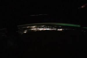 The photograph from the International Space Station looks back toward the northeast Atlantic coast of the United States revealing the city lights (from left) of Norfolk, Virginia, to Boston, Massachusetts. At far right, an aurora in northern Canada crowns the Earth's horizon.