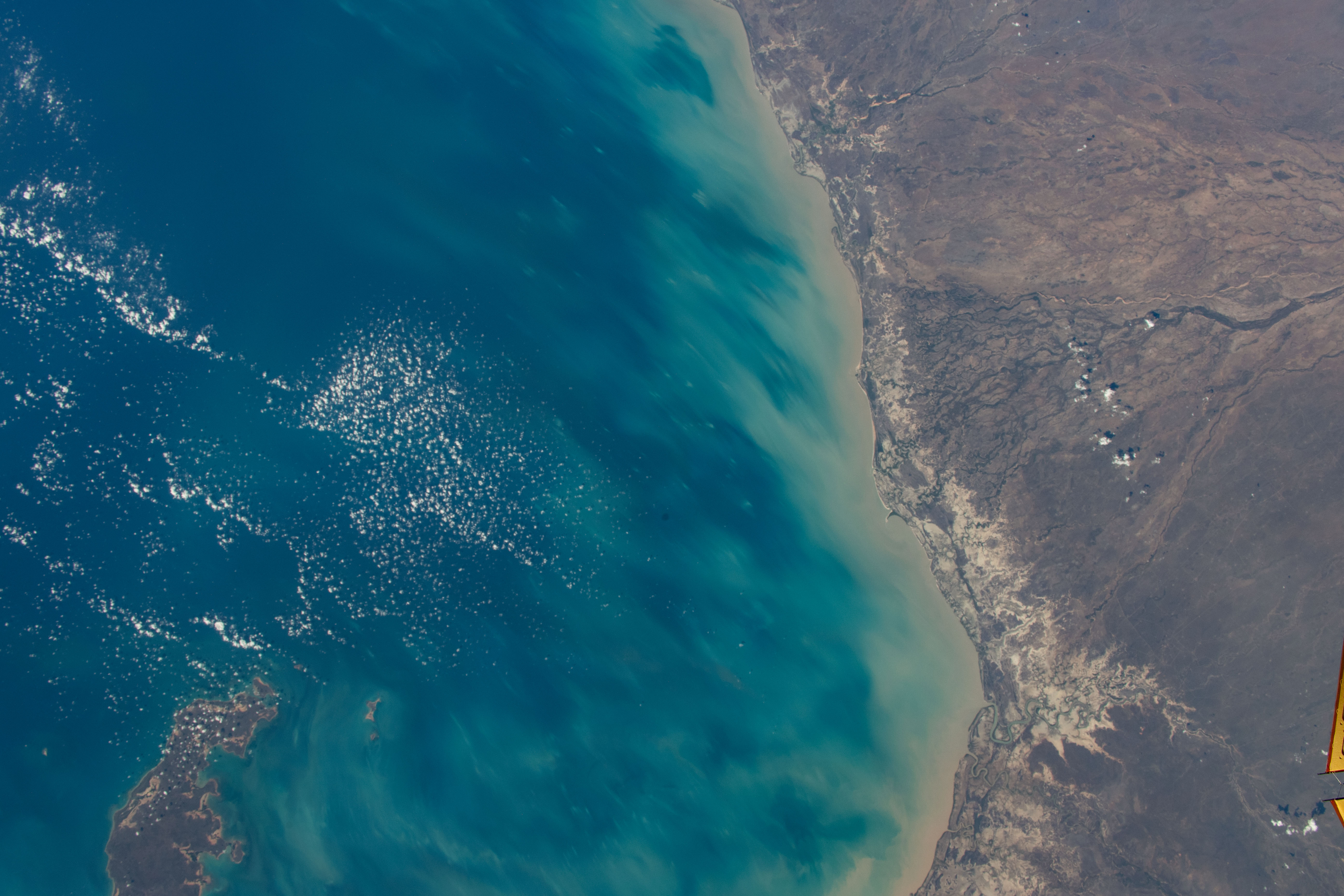 The coast of the Northwest region of Queensland, Australia, on the Gulf of Carpentaria is pictured from the International Space Station as it orbited 263 miles above the continental nation. At lower left, is Mornington Island and the Bountiful Islands.