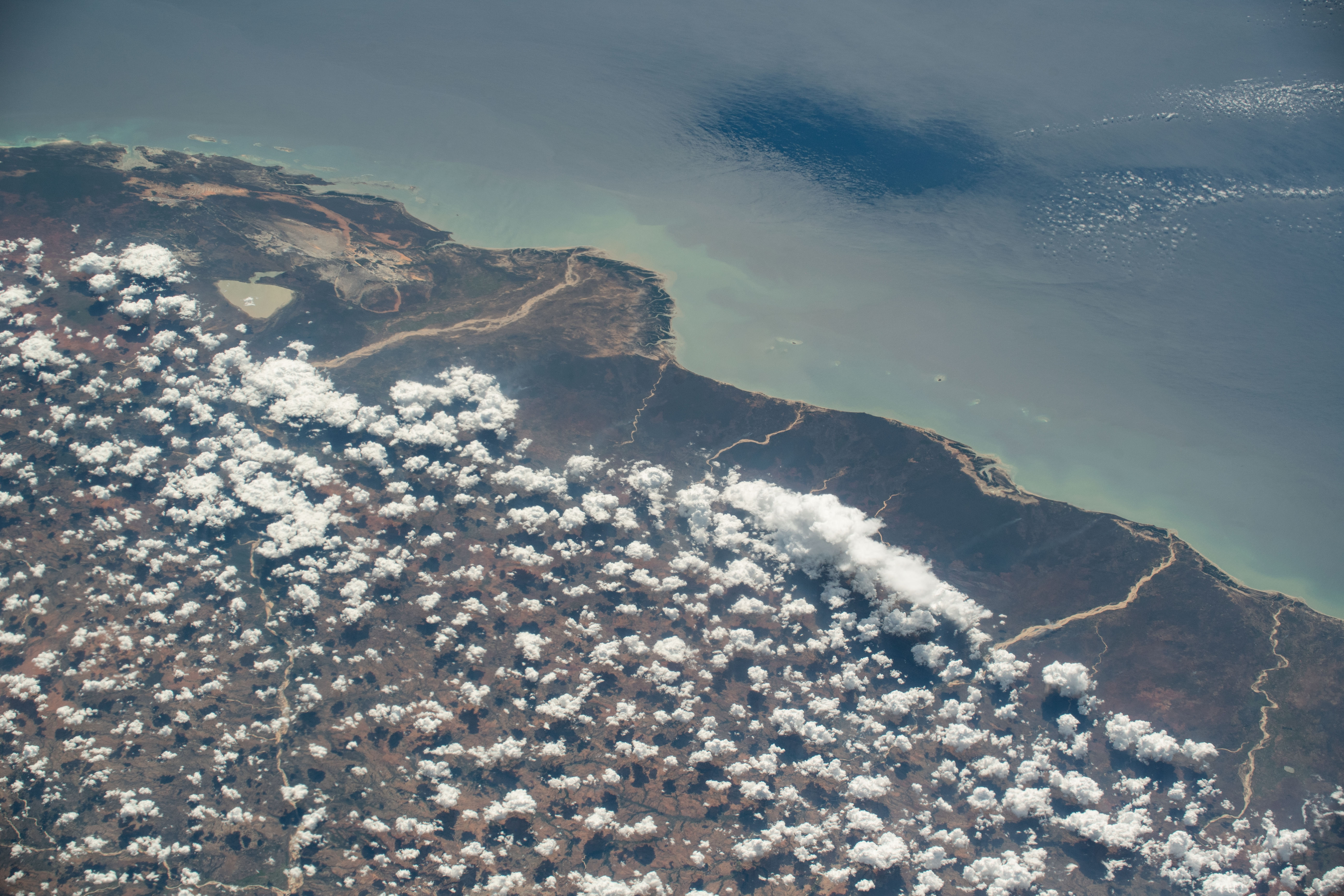 The partly cloudy coast of southwestern Madagascar on the Mozambique Channel is pictured from the International Space Station as it orbited 264 miles above the island nation.