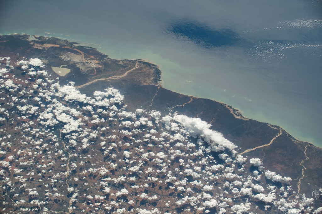 The partly cloudy coast of southwestern Madagascar on the Mozambique Channel is pictured from the International Space Station as it orbited 264 miles above the island nation.