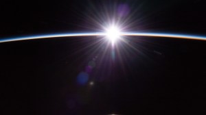 The sun's first rays burst through the Earth's atmosphere in this photograph from the International Space Station as it orbited 264 miles above the Pacific Ocean northeast of New Zealand.