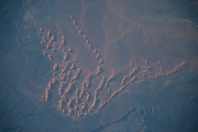 Sand dunes and massifs in the Algerian Desert are pictured from the International Space Station as it orbited 260 miles above the north African nation.