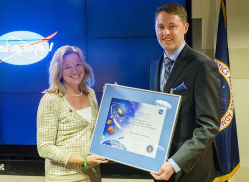 Dr. Ellen Stofan presenting the PECASE Award to Joshua Alwood