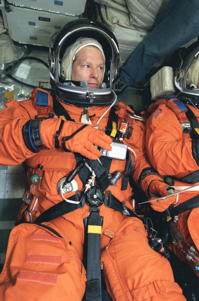 Astronaut William Shepherd, Expedition 1 mission commander, lies on a couch on the mid deck of a Johnson Space Center trainer during a rehearsal of shuttle descent. Shepherd and his Expedition 1 crewmates will return from their stay aboard ISS in the Space Shuttle Discovery around mid February 2001.