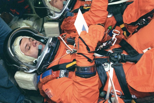 Cosmonaut Yuri Gidzenko, Expedition 1 Soyuz commander, lies on a couch on the mid deck of a Johnson Space Center trainer during a rehearsal of shuttle descent. Gidzenko and his Expedition 1 crewmates will return from their stay aboard ISS in the Space Shuttle Discovery around mid February 2001.
