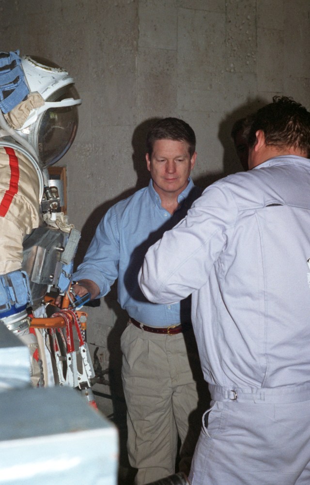 Astronaut William Shepherd, mission commander for ISS Expedition 1, is about to change from street clothes into an Orlan space suit in order to participate in an underwater spacewalk simulation in the Hydrolab facility at the Gagarin Cosmonaut Training Center in Russia.