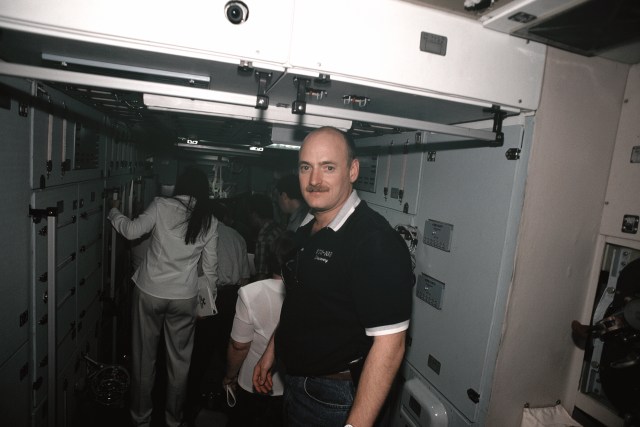 Astronaut Scott Kelly, director of operations - Russia, walks through a full scale trainer/mockup for the Zvezda Service Module at the Gagarin Cosmonaut Training Center in Russia. The Expedition 1 crew was training in another area of the SM when this photo was made.
