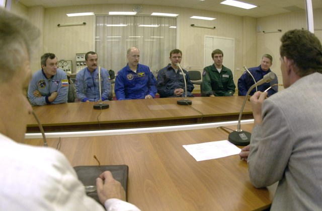 In background, from left, Vladimir N. Dezhurov, Mikhail Turin, Kenneth D. Bowersox, Yuri P. Gidzenko, Sergei K. Krikalev and William M. (Bill) Shepherd, the backup and prime crew members for Expedition 1, during conference prior to simulation at Baikonur complex in Kazakhstan.
