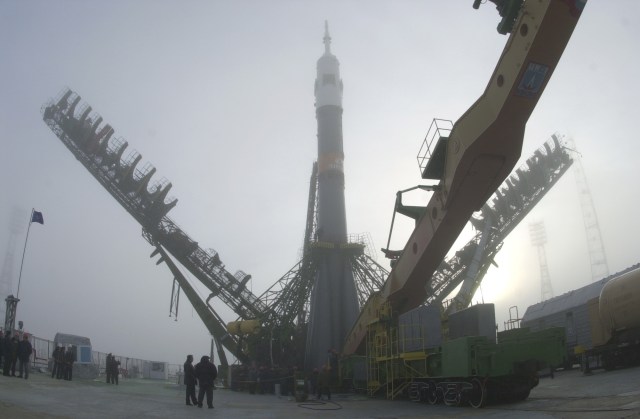 The Soyuz launch vehicle is moved into the vertical position for its launch from Baikonur in less than 48 hours.