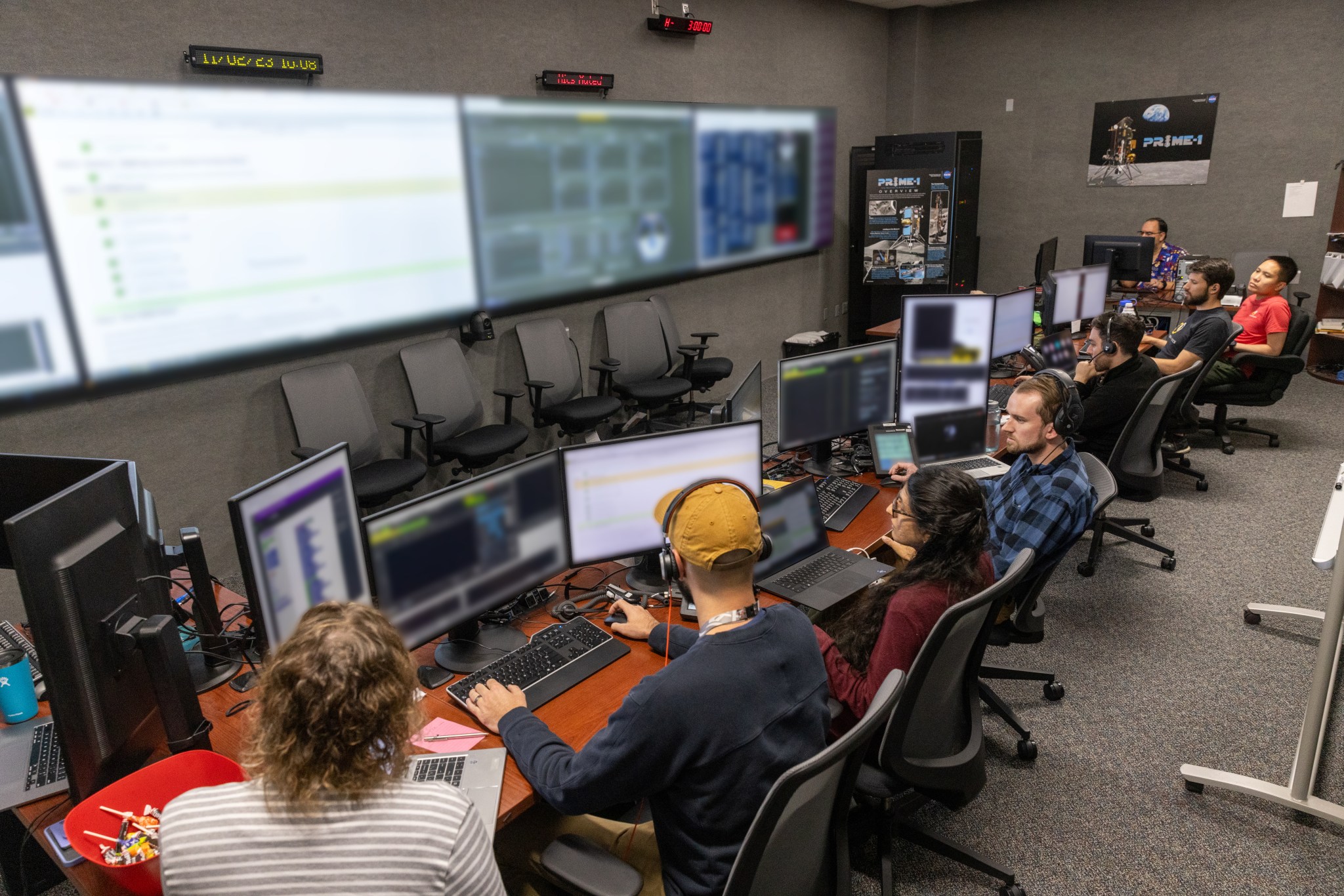 A team of engineers participates in simulation training for the Polar Resources Ice Mining Experiment-1 (PRIME-1) on Thursday, Nov. 2, 2023, inside the Neil Armstrong Operations and Checkout Building at NASA’s Kennedy Space Center in Florida.