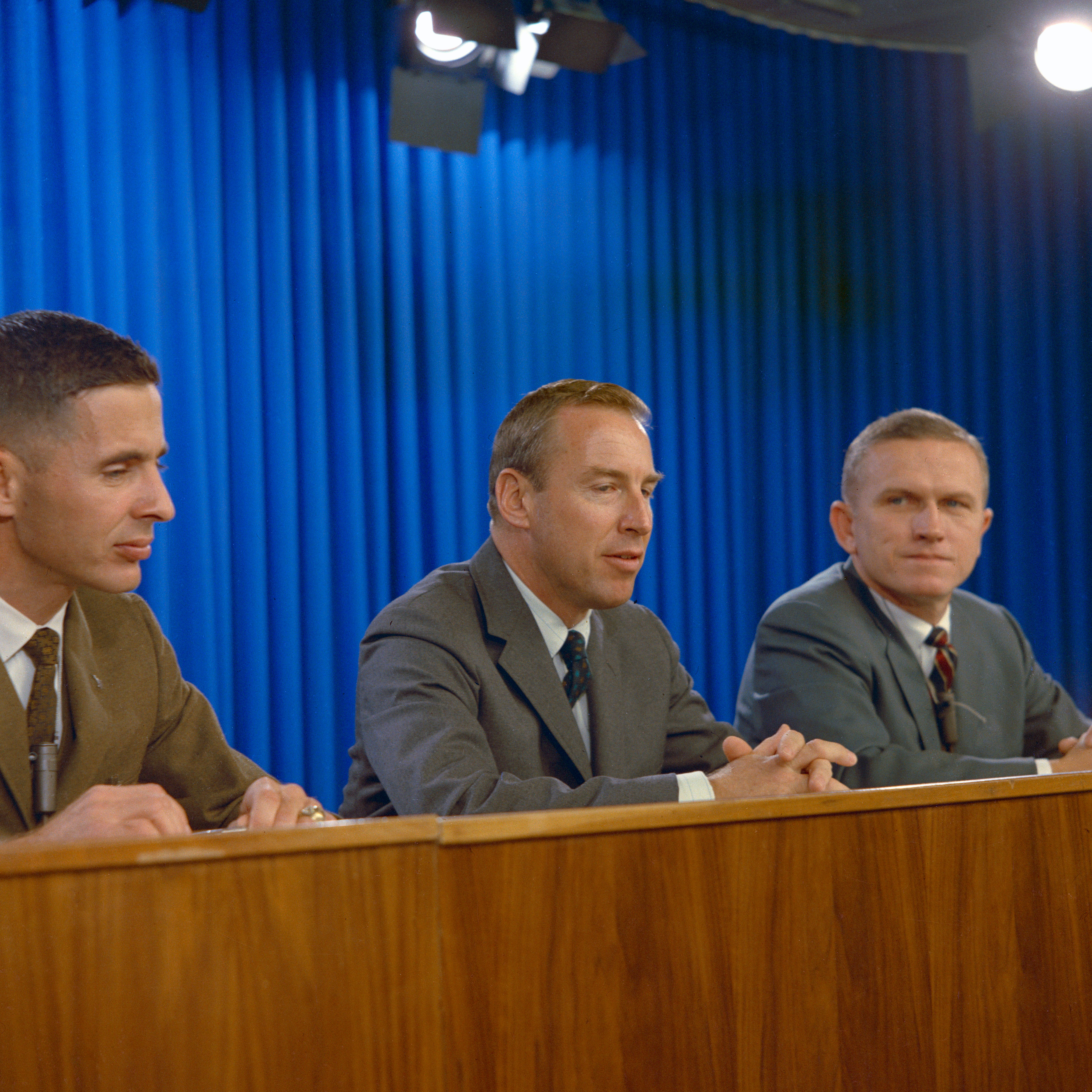 Apollo 8 astronauts William A. Anders, left, James A. Lovell, and Frank Borman during a press conference shortly after the announcement of their mission to orbit the Moon