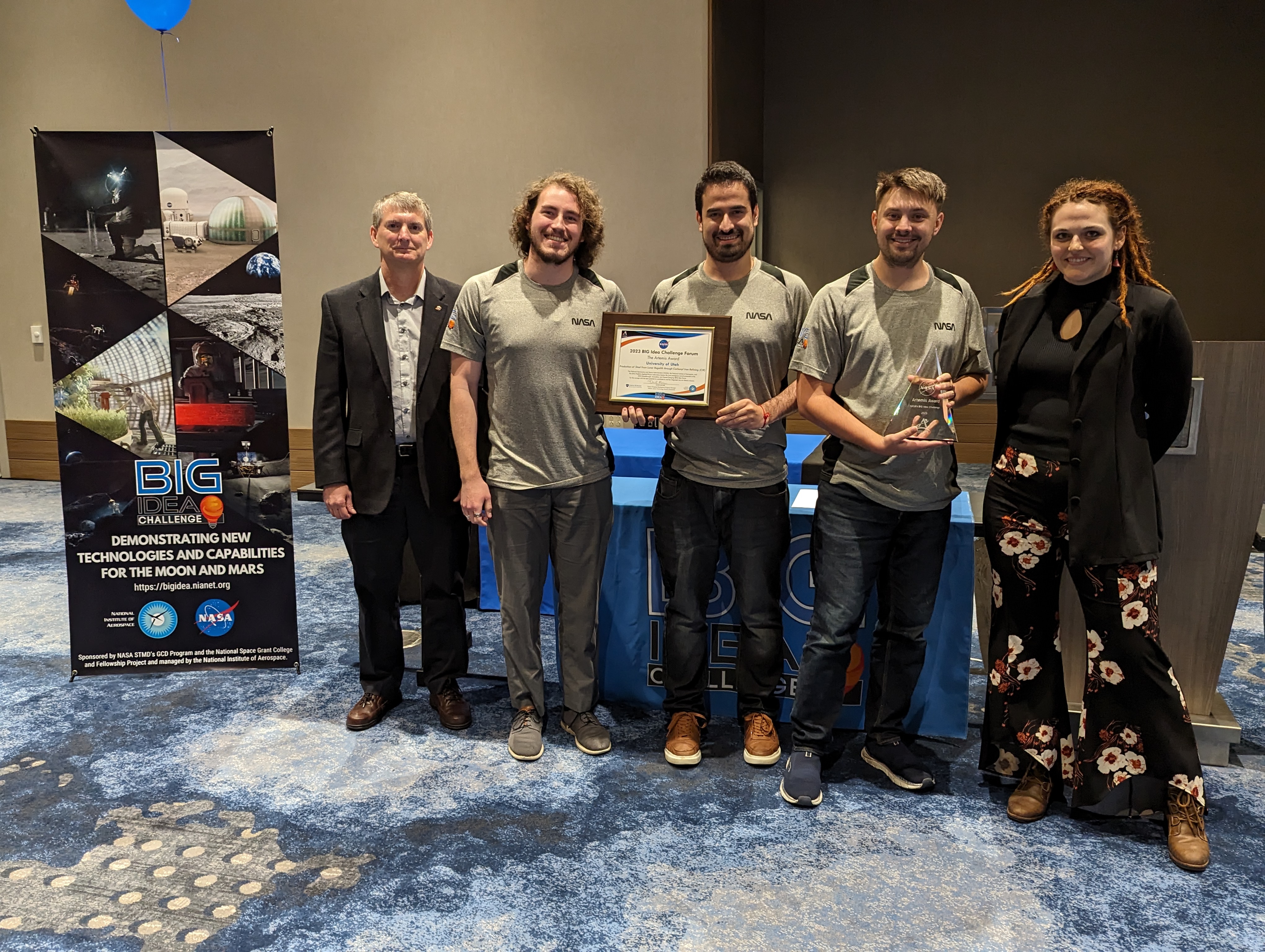 The University of Utah team, partnering with Powder Metallurgy Research Laboratory, earned the Artemis Award, which represents top honors in the 2023 BIG Idea Challenge. Pictured here with Dave Moore, Program Manager for NASA's Game Changing Development program.