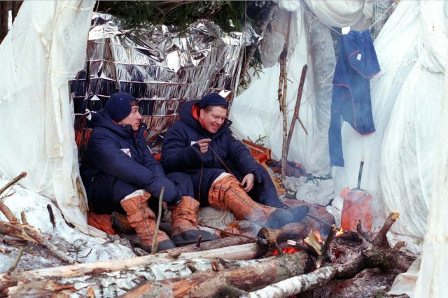 Astronaut Bill Shepherd, right, commander of the first crew that will live aboard the International Space Station, and Cosmonaut Sergei Krikalev, left, flight engineer for the first crew, practice survival skills during training in March 1998 near Star City, Russia. The crew, which also includes Cosmonaut Yuri Gidzenko as Soyuz Commander, participated in two days of Soyuz winter survival training to practice skills that could be needed in the event the Soyuz spacecraft landed in a location where the crew could not immediately be reached.