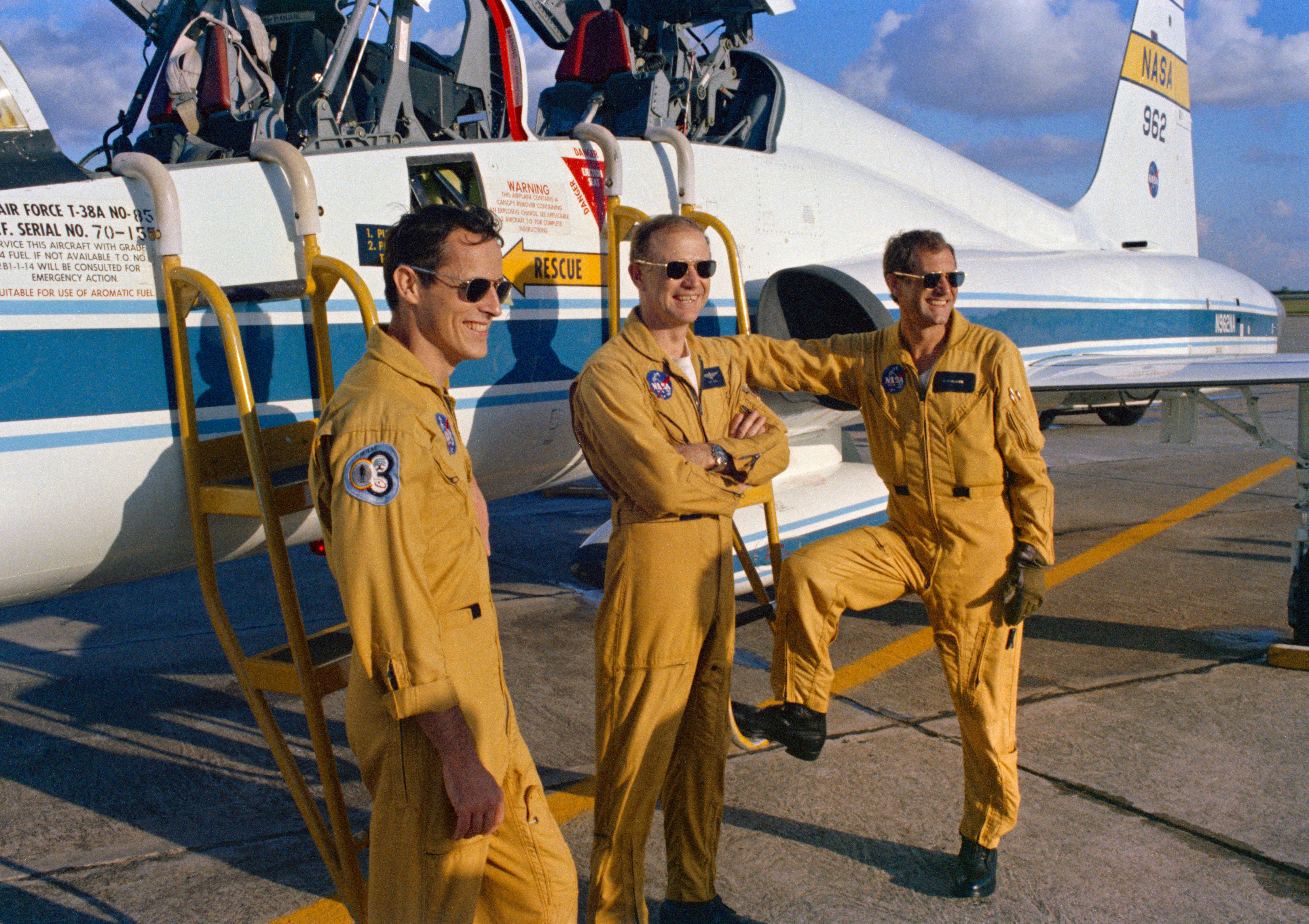 Photo of Gibson, left, Carr, and Pogue pose in front of a T-38 Talon aircraft at Ellington Air Force Base in Houston prior to their departure for NASA’s Kennedy Space Center in Florida for the launch