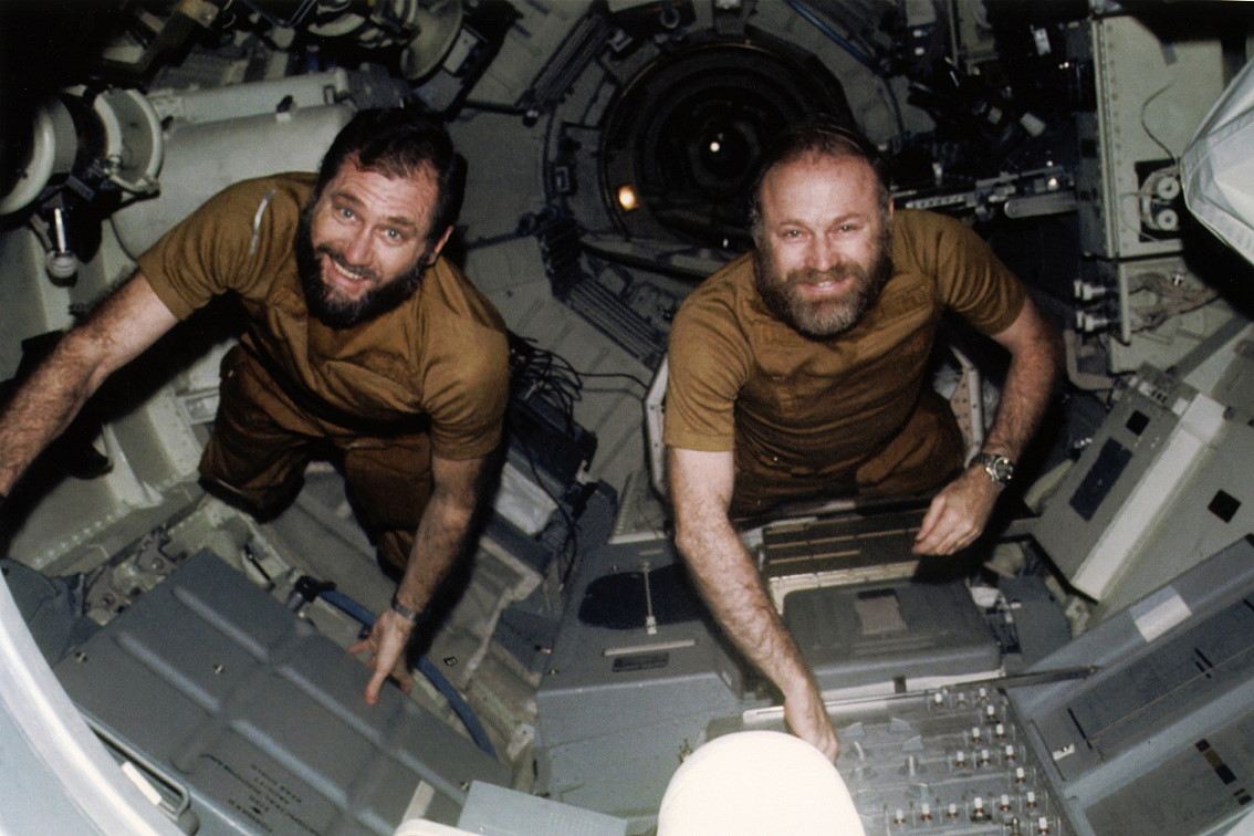 Breaking News Image of William R. Pogue, left, and Gerald P. Carr on the retain watch over panel for the Earth Resources Experiment bundle contained within the More than one Docking Adapter