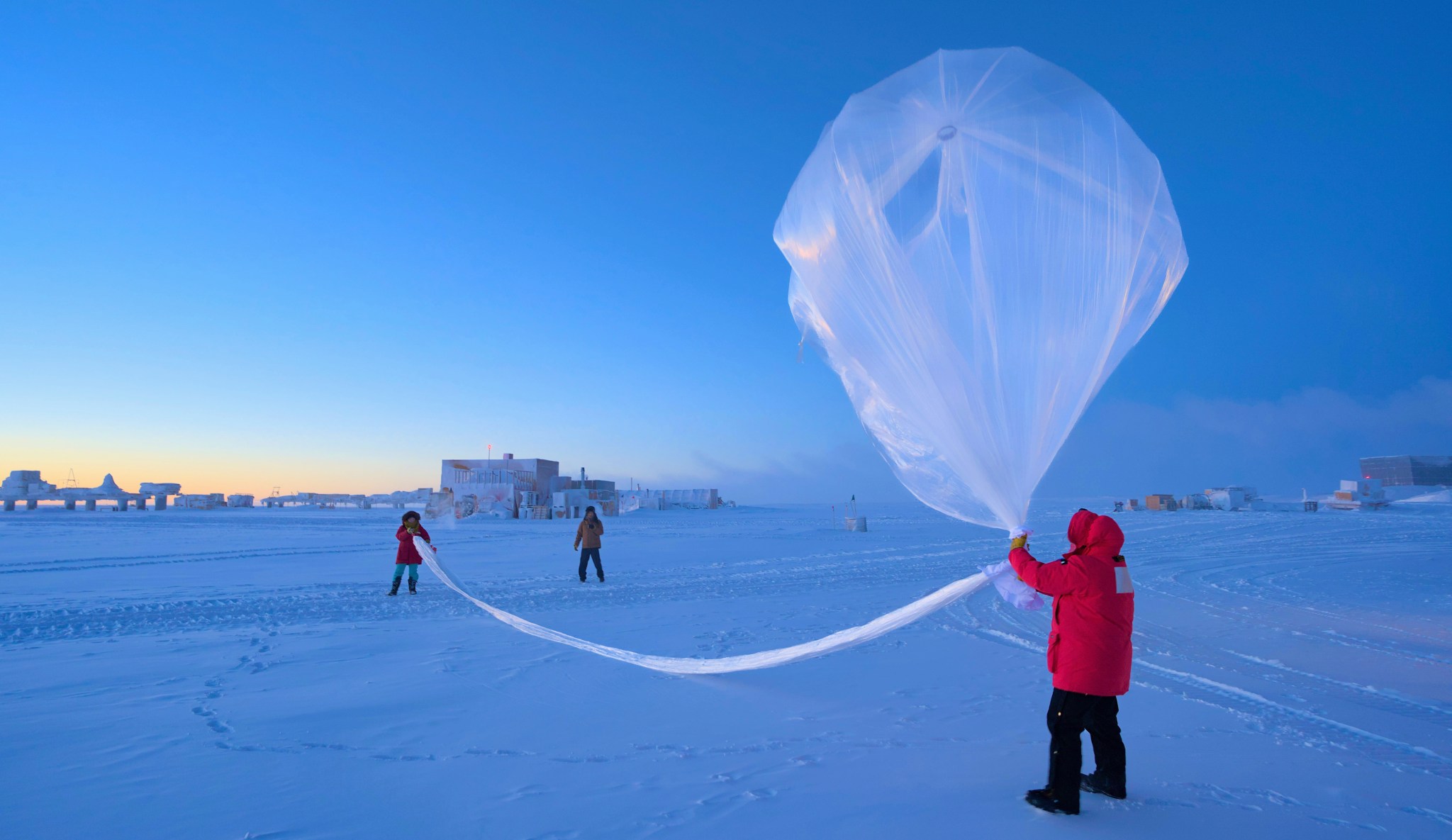 NOAA scientists launch a weather balloon carrying an ozonesonde at the South Pole on Oct. 1, 2023.
