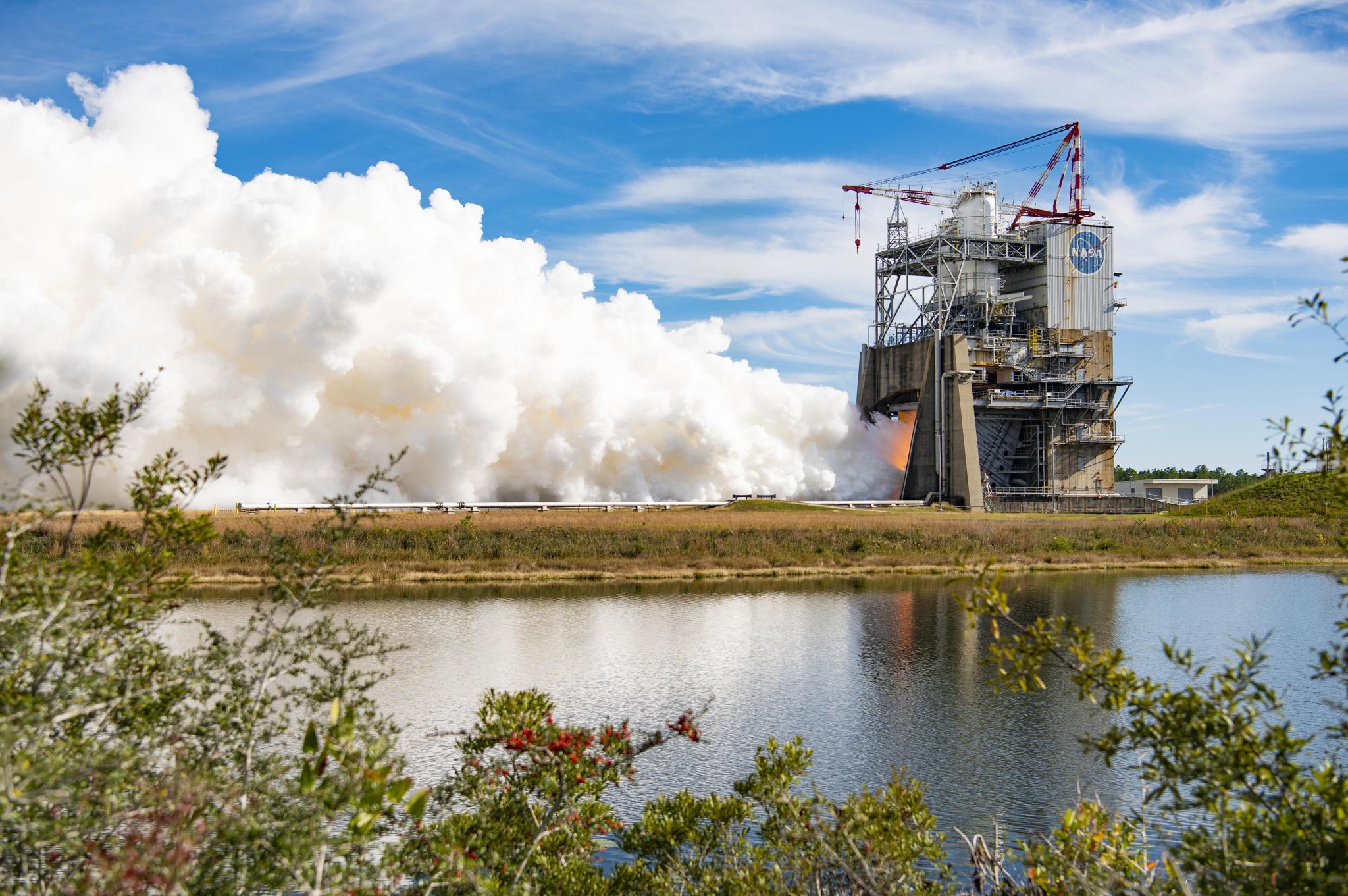 Vapor clouds erupt from a RS-25 Engine during testing