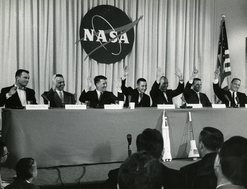 Image of The Mercury 7 astronauts Donald K. Slayton, left, Alan B. Shepard, Walter M. Schirra, Virgil I. “Gus” Grissom, John H. Glenn, L. Gordon Cooper, and M. Scott Carpenter during their introductory press conference