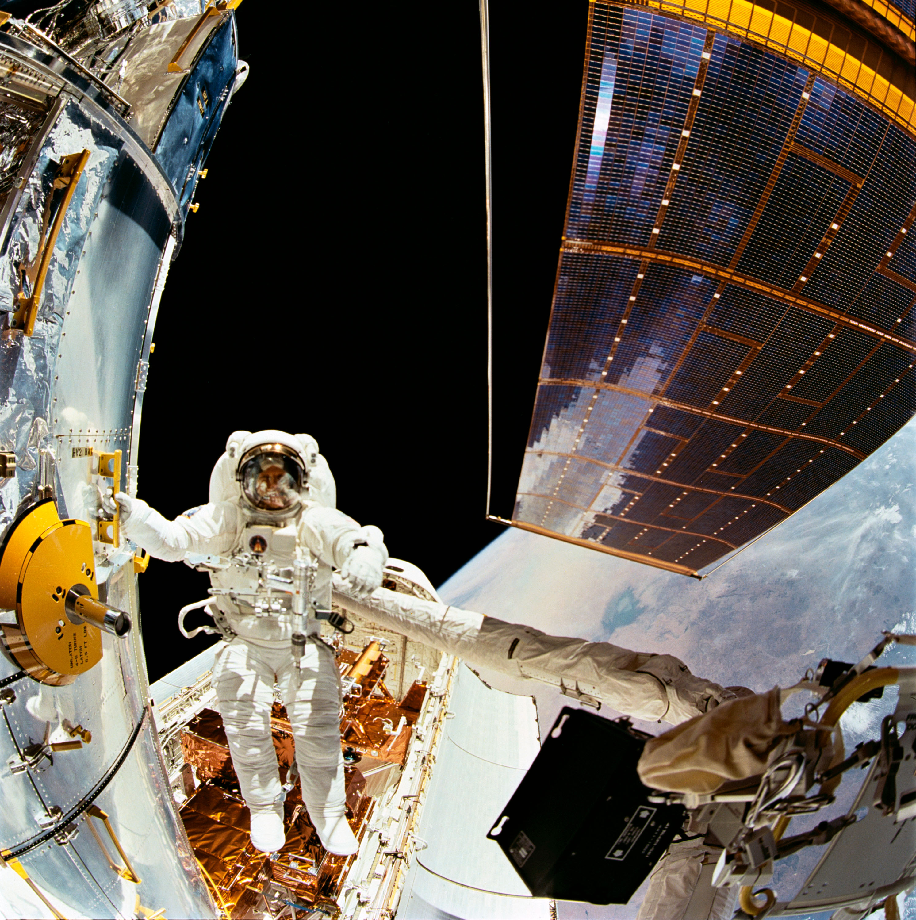 Astronaut F. Story Musgrave works on the Hubble