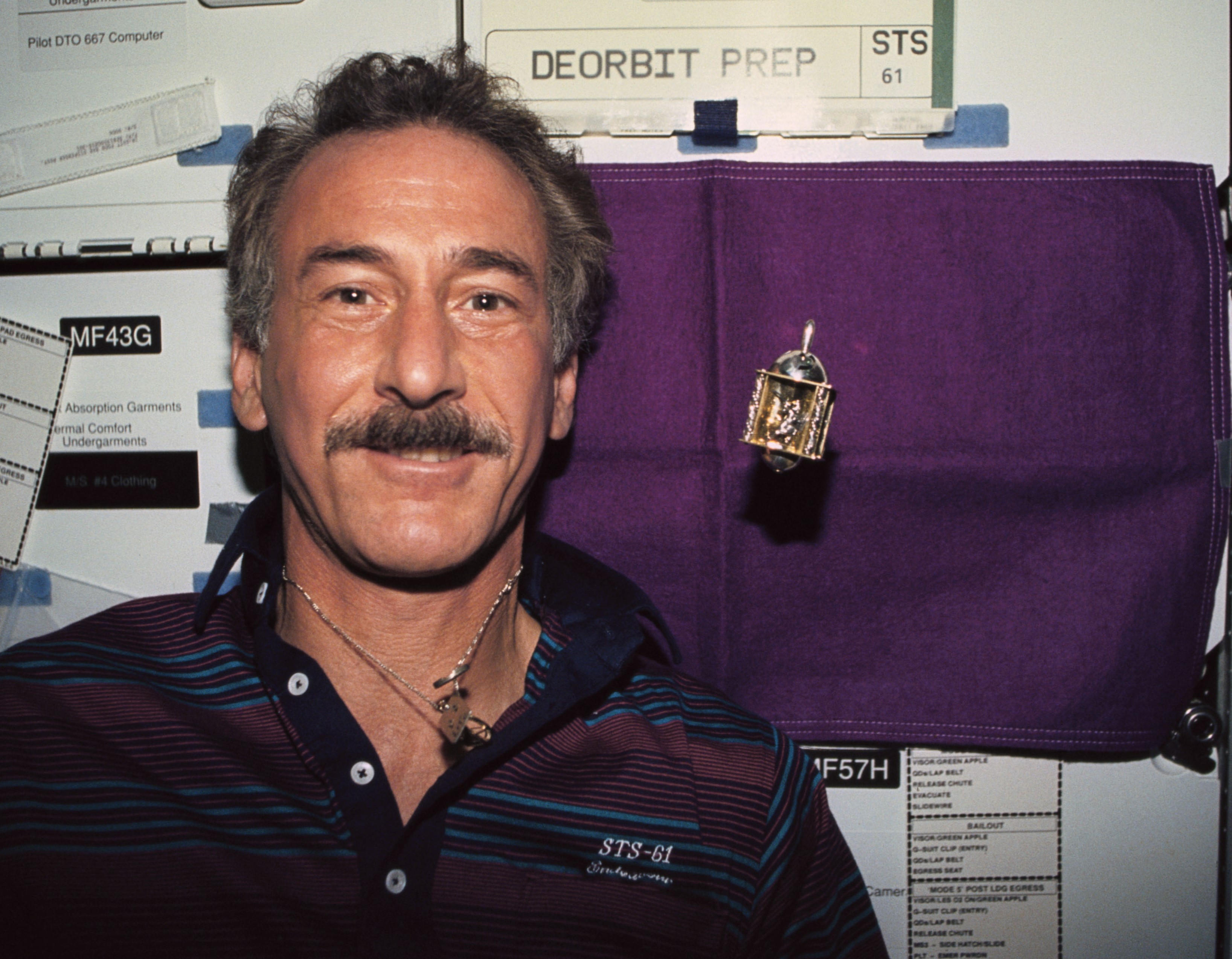 Hoffman celebrates the first Hannukah in space, with a spinning dreidel floating nearby