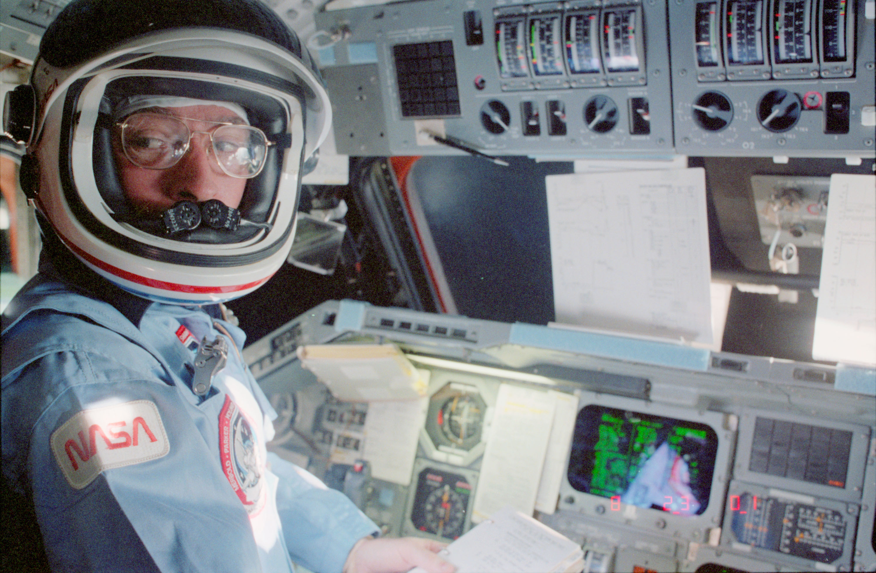 John W. Young in the shuttle commander’s seat prior to entry and landing