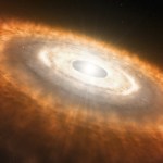 The image is dominated by a dusty disk extending from upper left to lower right and tilted toward the viewer. It resembles patchy clouds with small rocky bits scattered throughout. At 4 o’clock and 11 o’clock are two small, embedded planets. The outer edges of the disk are reddish, the middle orange, and the inner region yellow-white. At the center is a gap within which is a bright white star.