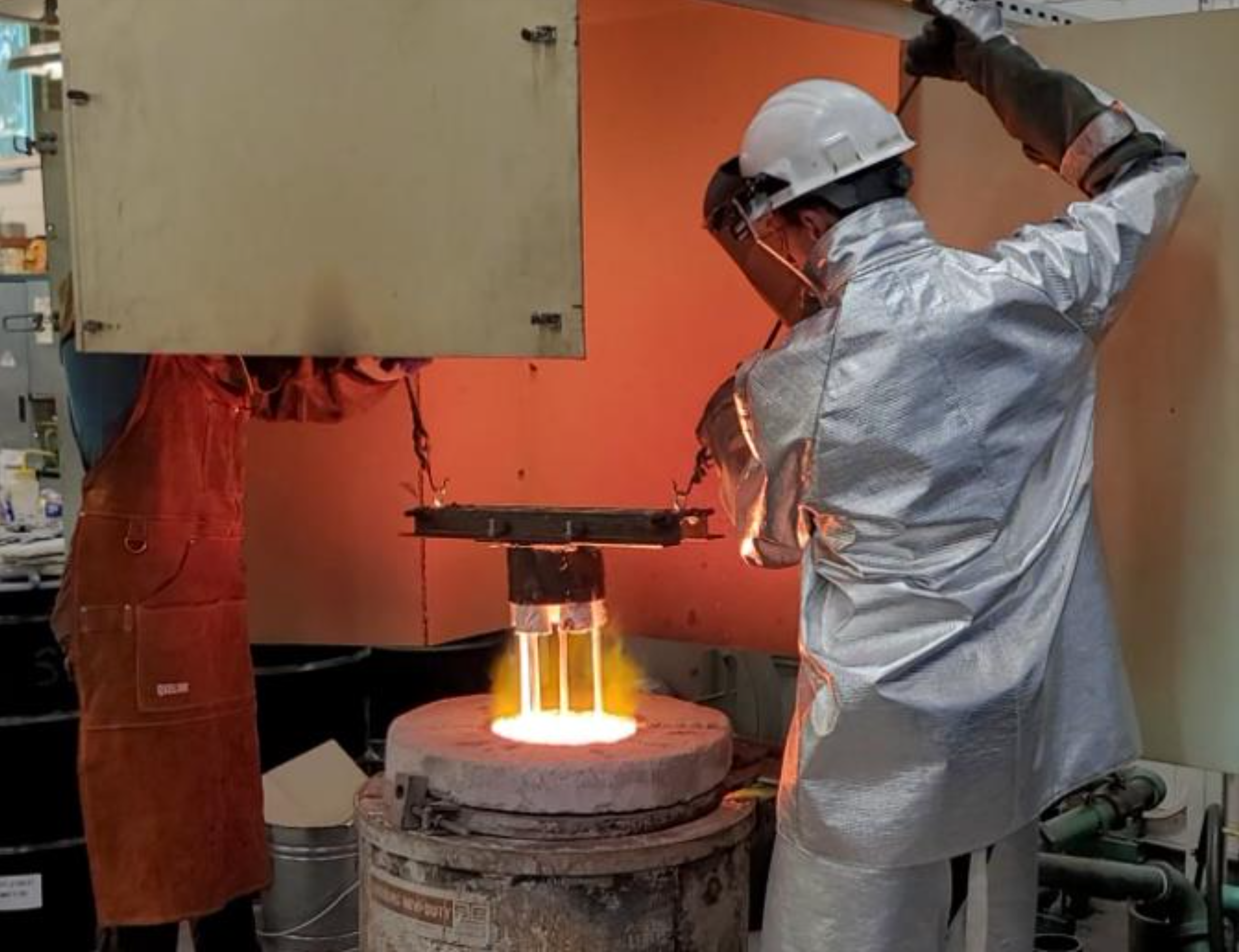 Colorado School of Mines team members are shown submerging the housing into a furnace holding simulated regolith melt > 1,300°C in the 2023 BIG Idea Challenge.» decoding=»async» block_context=»nasa-block» srcset=»https://www.nasa.gov/wp-content/uploads/2023/11/submerging-housing.png 2346w, https://www.nasa.gov/wp-content/uploads/2023/11/submerging-housing.png?resize=300,230 300w, https://www.nasa.gov/wp-content/uploads/2023/11/submerging-housing.png?resize=768,590 768w, https://www.nasa.gov/wp-content/uploads/2023/11/submerging-housing.png?resize=1024,787 1024w, https://www.nasa.gov/wp-content/uploads/2023/11/submerging-housing.png?resize=1536,1180 1536w, https://www.nasa.gov/wp-content/uploads/2023/11/submerging-housing.png?resize=2048,1573 2048w, https://www.nasa.gov/wp-content/uploads/2023/11/submerging-housing.png?resize=400,307 400w, https://www.nasa.gov/wp-content/uploads/2023/11/submerging-housing.png?resize=600,461 600w, https://www.nasa.gov/wp-content/uploads/2023/11/submerging-housing.png?resize=900,691 900w, https://www.nasa.gov/wp-content/uploads/2023/11/submerging-housing.png?resize=1200,922 1200w, https://www.nasa.gov/wp-content/uploads/2023/11/submerging-housing.png?resize=2000,1536 2000w» sizes=»(max-width: 640px) 100vw, 640px»></figure><figcaption class=