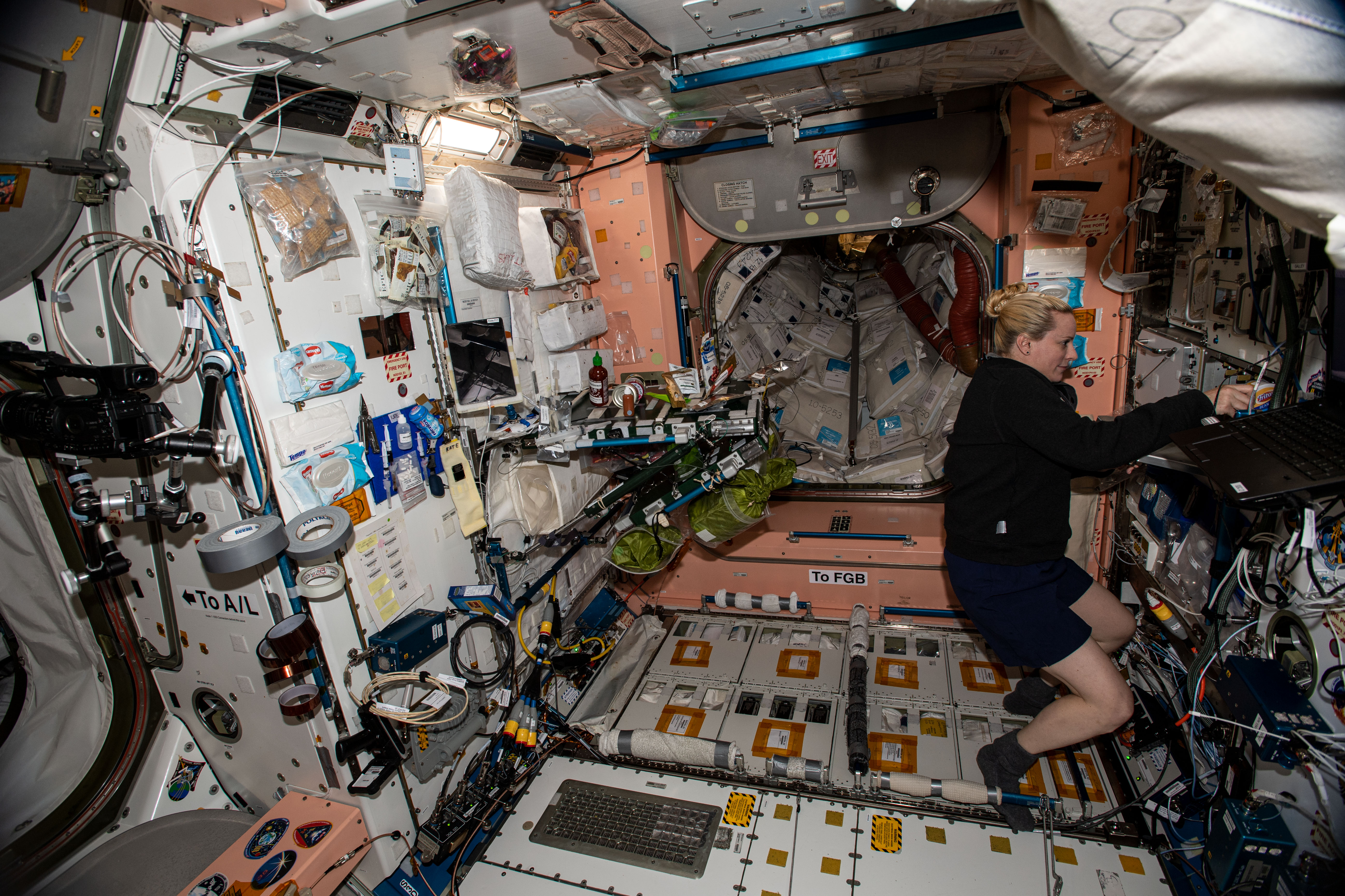 Expedition 64 NASA astronaut Kathleen H. “Kate” Rubins prepares the Thanksgiving dinner