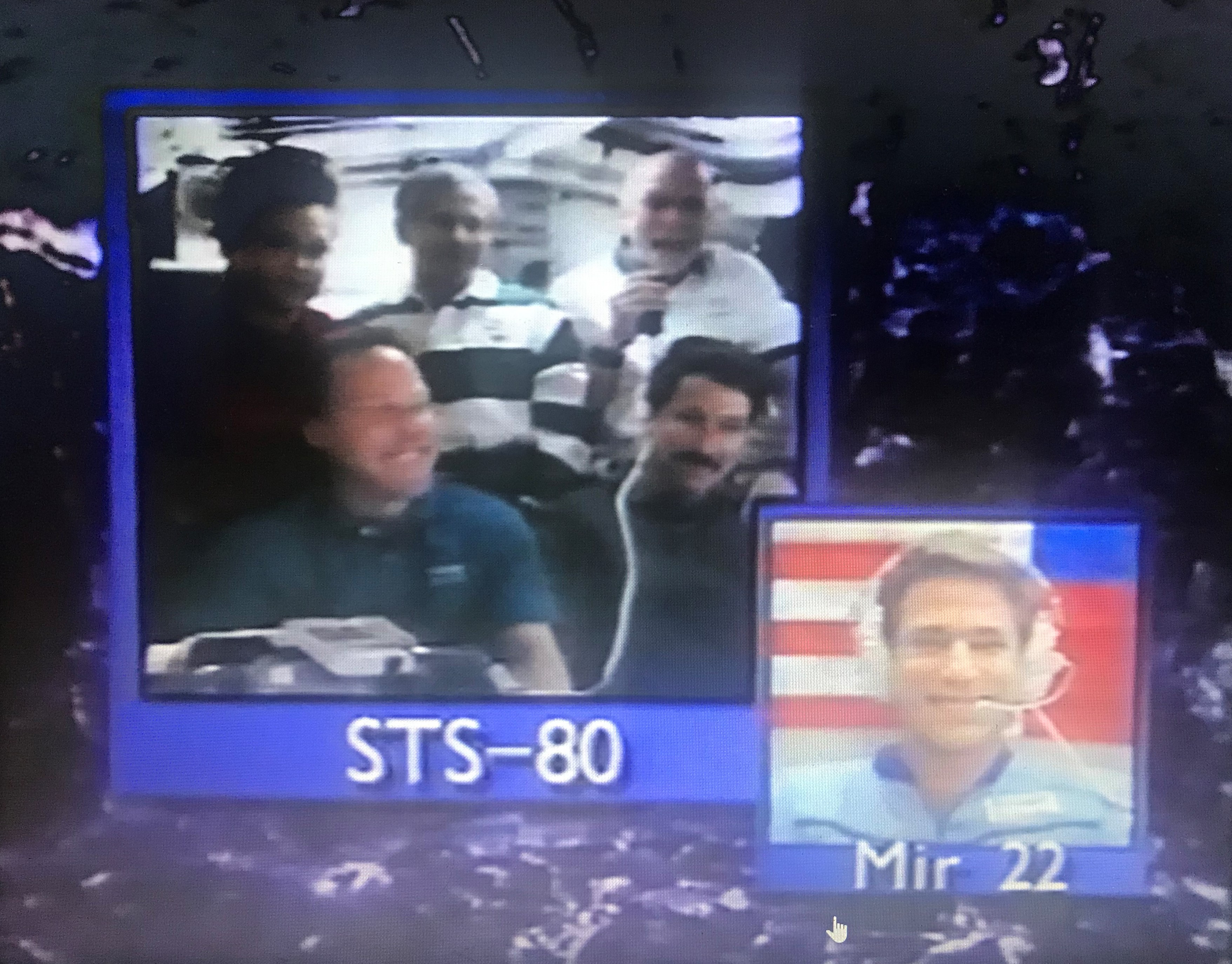The STS-80 crew during aboard Columbia exchanging Thanksgiving greetings with John E. Blaha aboard the Mir space station