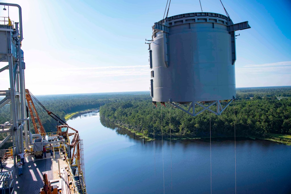 interstage simulator floats high in the sky while being hoisted onto the Thad Cochran Test Stand