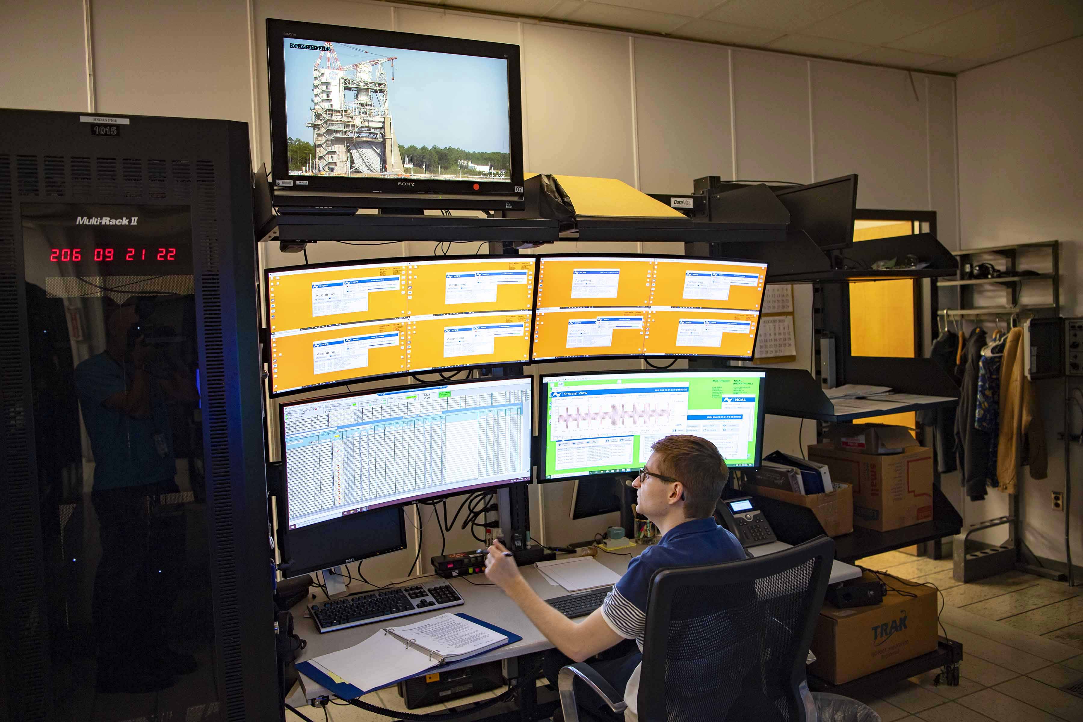 Engineer prepping for an RS-25 engine test in the test control center at NASA Stennis.