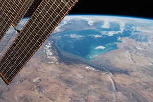 iss070e033718 (Nov. 30, 2023) -- Orbiting nearly 260 miles above the Middle East, NASA astronaut Jasmin Moghbeli captured this image of the Persian Gulf. In the foreground, one of the International Space Station's solar arrays is visible, detailing the intricate solar cells that make up the hardware.