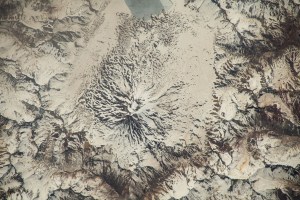 iss070e036437 (Nov. 26, 2023) -- Maipo, a stratovolcano in the Andes Mountains bordering Chile and Argentina, is highlighted by snow cover as the International Space Station orbited 265 miles above. Just east of the mountains peak (near the top of the image) lies Laguna del Diamante, covered in ice.