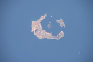 iss070e044900 (Dec. 23, 2023) -- The capital of Santorini, Fira Island, was photographed as the International Space Station orbited 259 miles above. The specs of white lining the edge of the caldera are actually whitewashed houses built on terrain that reaches roughly 1,300 feet (~400 meters) high.