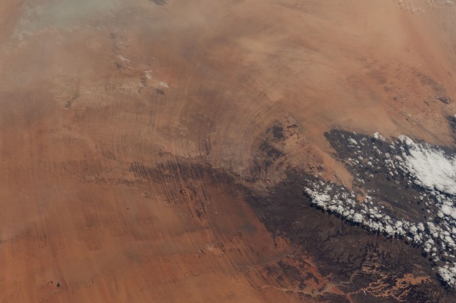A portion of the Tibesti Mountains (lower right), in the Saharan region of the nation of Chad, is pictured from the International Space Station as it orbited 257 miles above the African continent.