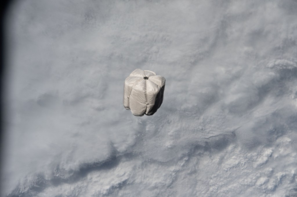 A trash container is pictured on a trajectory away from the International Space Station and toward the Earth's atmosphere for a fiery, but safe disposal. The trash container had been jettisoned moments earlier from the Nanoracks Bishop Airlock while attached to the Canadarm2 robotic arm.