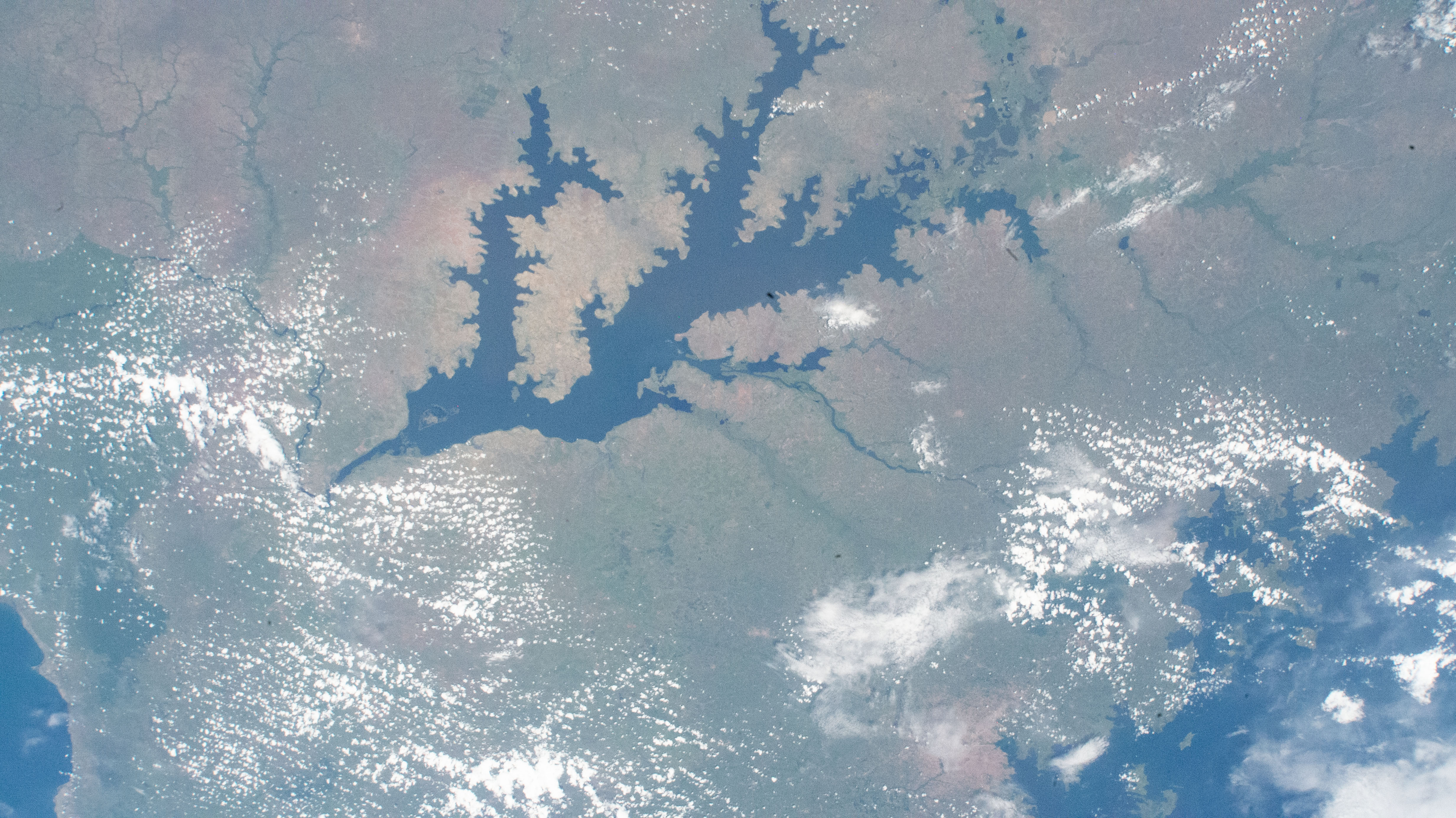 Several bodies of water are pictured including Lake Albert (at lower left); and Lakes Kwania, Kyoga, and Kojweri (at center); and Lake Victoria (at bottom right); as the International Space Station orbited 261 miles above the African nation of Uganda.