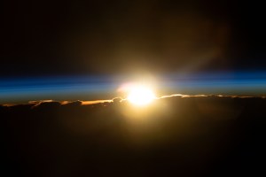 The International Space Station was soaring into an orbital sunrise 259 miles above the U.S. territory of Guam in the Pacific Ocean at the time of this photograph.