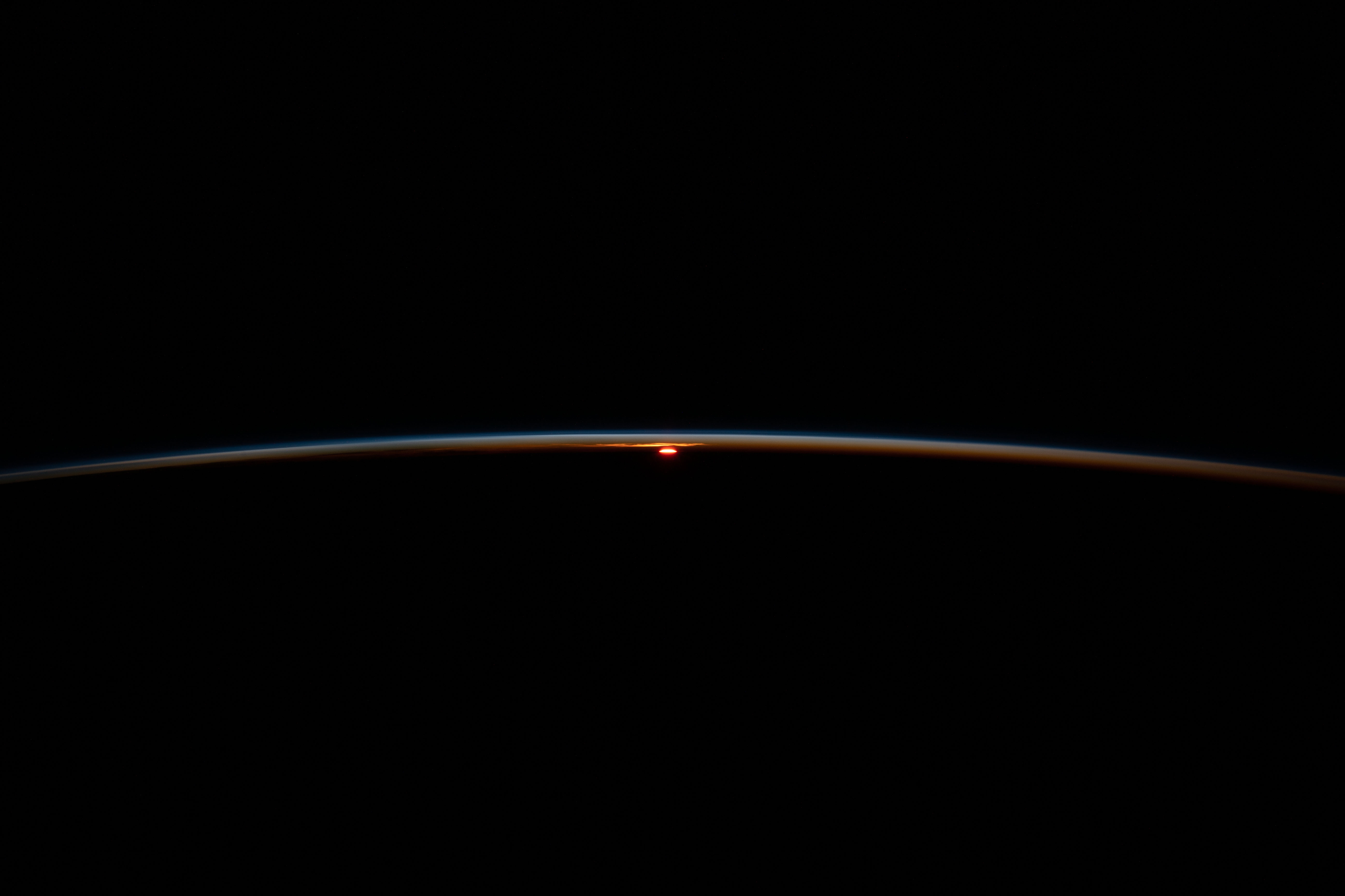 The International Space Station flies into an orbital sunset at an altitude of 266 miles above the Atlantic Ocean off the coast of South Africa.
