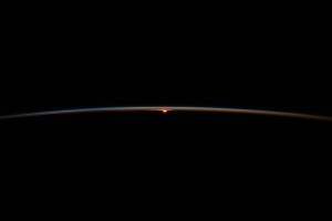 The International Space Station flies into an orbital sunset at an altitude of 266 miles above the Atlantic Ocean off the coast of South Africa.