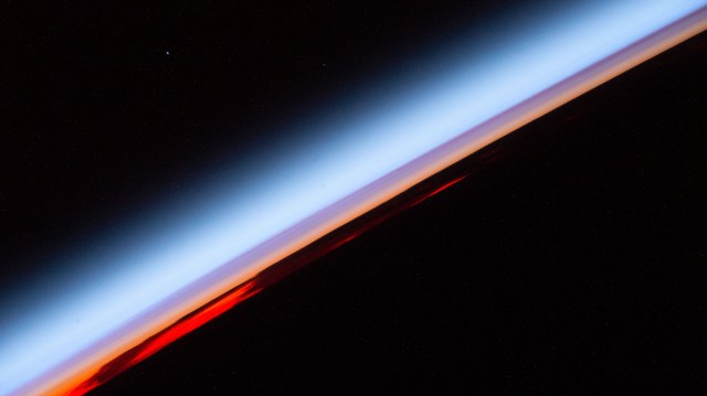 An orbital sunset is pictured from the International Space Station as it was soaring 267 miles above the south Pacific Ocean.
