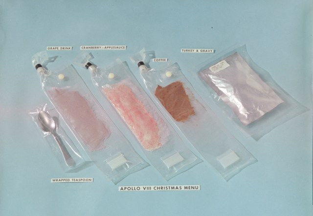 4 packets of food and a spoon wrapped in plastic that were served to the Apollo 8 crew for Christmas