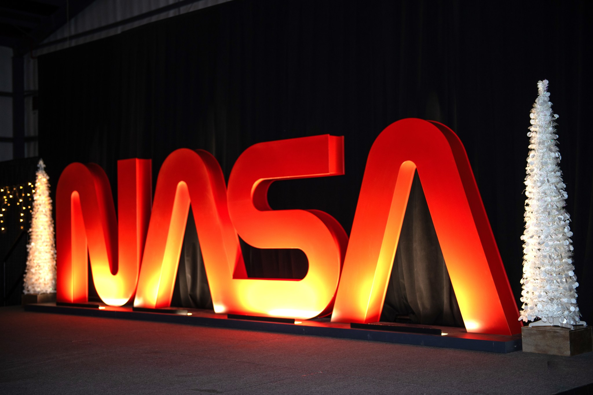 The NASA worm logo flanked by two holiday trees was just one of the ways Activities Building 4316 was decked out for a merry holiday reception Dec. 7.