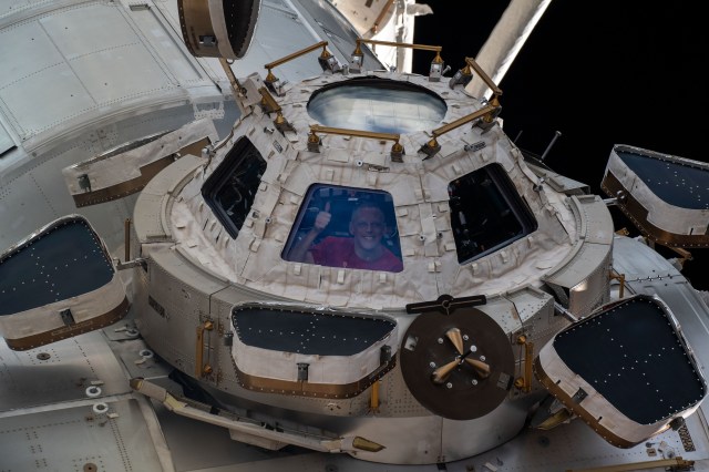 NASA astronaut and Expedition 67 Flight Engineer Bob Hines is pictured looking out from a window on the cupola, the International Space Station's "window to the world." The astronauts use the seven-windowed cupola to monitor the arrival of spaceships at the orbiting lab and view the Earth below.