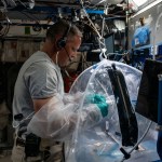 NASA astronaut and Expedition 67 Flight Engineer Bob Hines works inside the portable glovebag processing biological samples for the Food Physiology study. The human research experiment aims to define targeted, more efficient dietary interventions to maintain crew health and performance as well as the food system requirements to support these interventions.