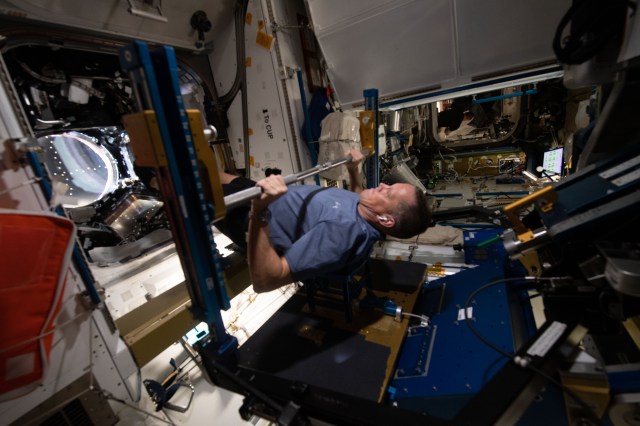 NASA astronaut and Expedition 67 Flight Engineer Bob Hines works out on the Advanced Resistive Exercise Device (ARED) inside the International Space Station's Tranquility module. The ARED mimics the inertial forces generated when lifting free weights on Earth enabling crew members to experience load and maintain muscle strength and mass during a long-term space mission.